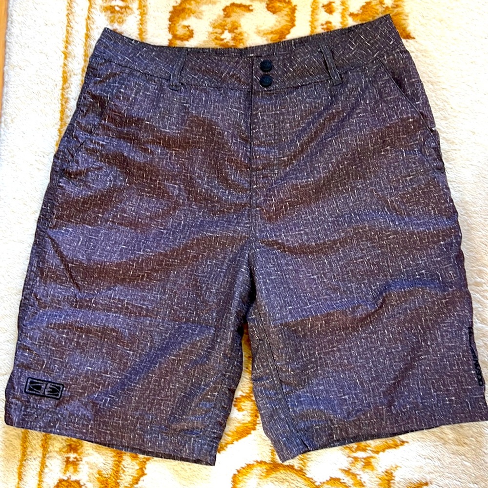 Ocean Earth medium hybrid shorts with attached waterproof carry pouch.